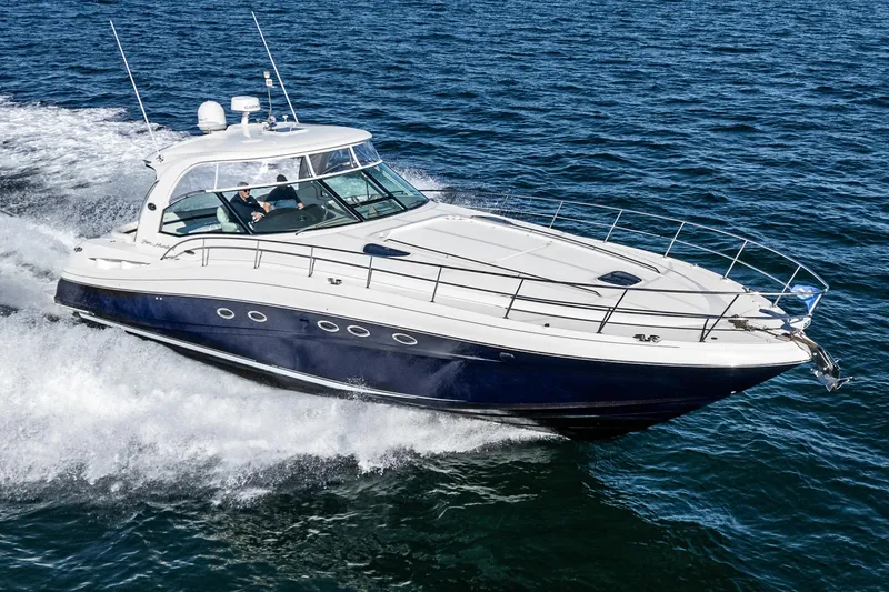 Slide: The Image of 2005 Sea Ray 500 Sundancer yacht cruising on open water. - 11