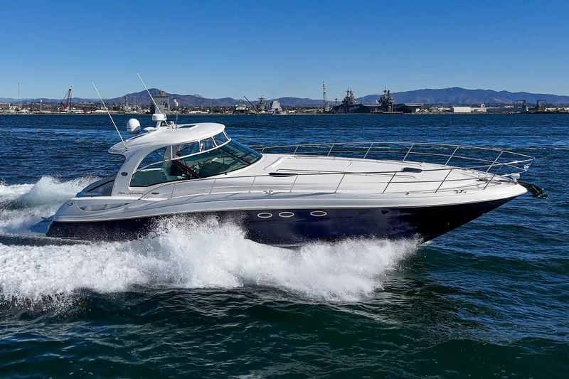 Slide: The Image of 2005 Sea Ray 500 Sundancer yacht cruising on open water. - 12