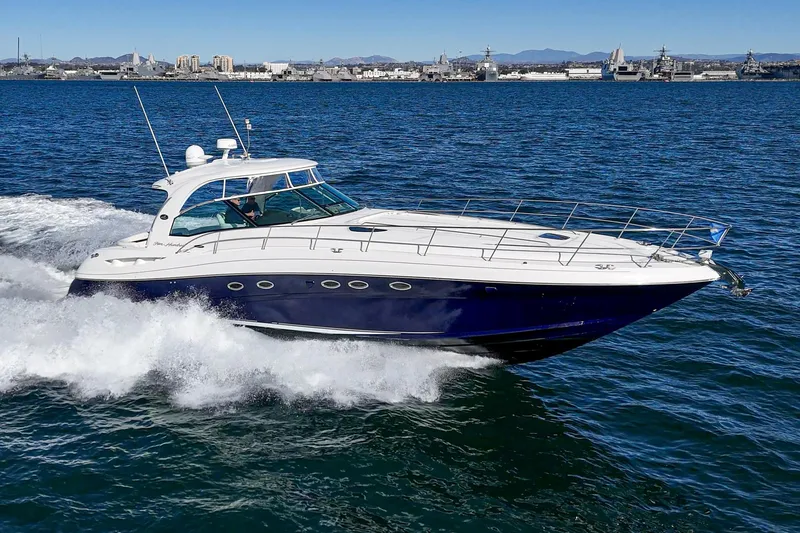 Slide: The Image of 2005 Sea Ray 500 Sundancer cruising on open water, showcasing sleek design and powerful performance. - 13