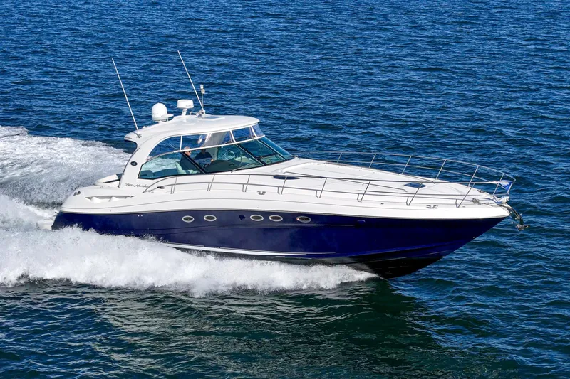 Slide: The Image of 2005 Sea Ray 500 Sundancer yacht cruising on open water. - 14