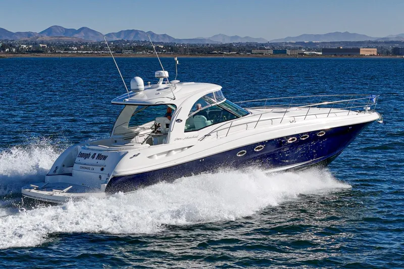 Slide: The Image of 2005 Sea Ray 500 Sundancer yacht cruising on open water. - 15