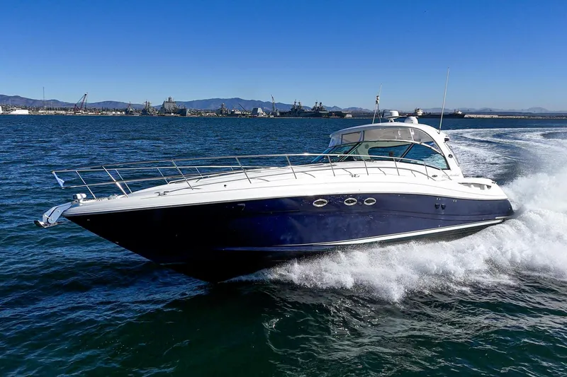 Slide: The Image of 2005 Sea Ray 500 Sundancer yacht cruising on open water. - 19
