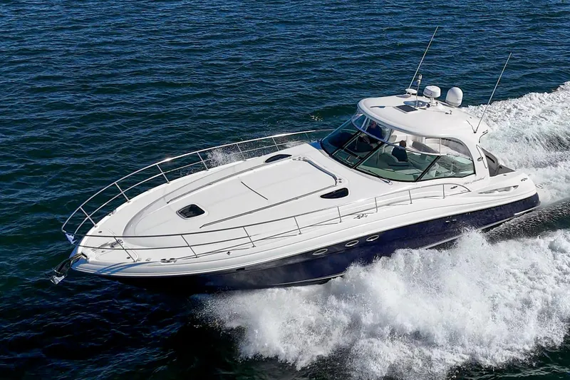 Slide: The Image of 2005 Sea Ray 500 Sundancer cruising on open water, showcasing sleek design and powerful performance. - 2