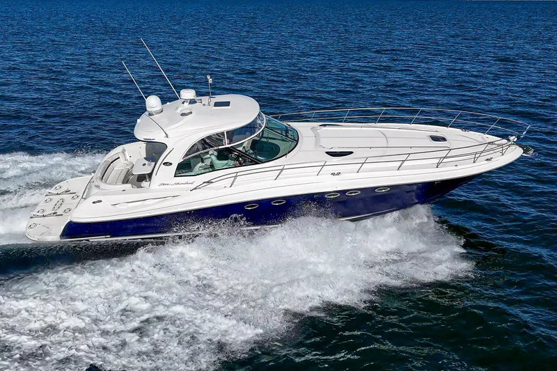 Slide: The Image of 2005 Sea Ray 500 Sundancer cruising on open water, showcasing sleek design and performance. - 21