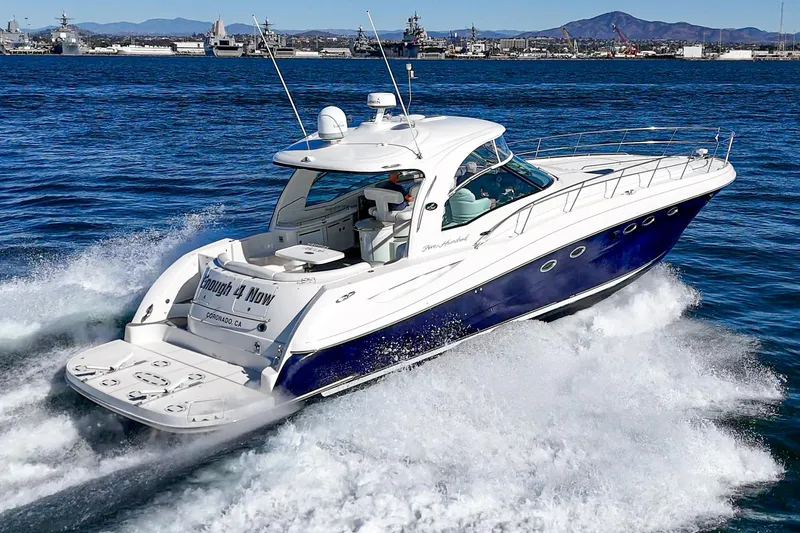 Slide: The Image of 2005 Sea Ray 500 Sundancer cruising on open water, showcasing sleek design and powerful performance. - 23