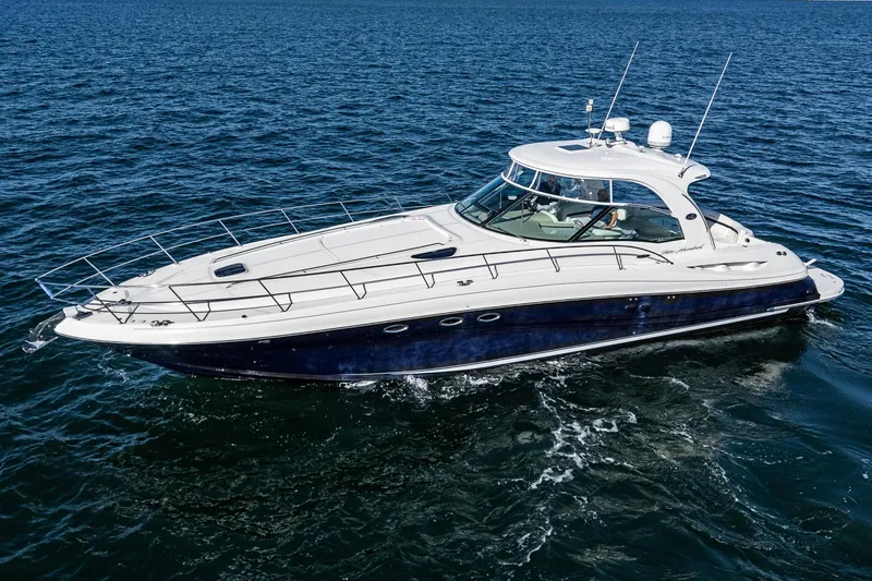 Slide: The Image of 2005 Sea Ray 500 Sundancer yacht cruising on open water. - 24