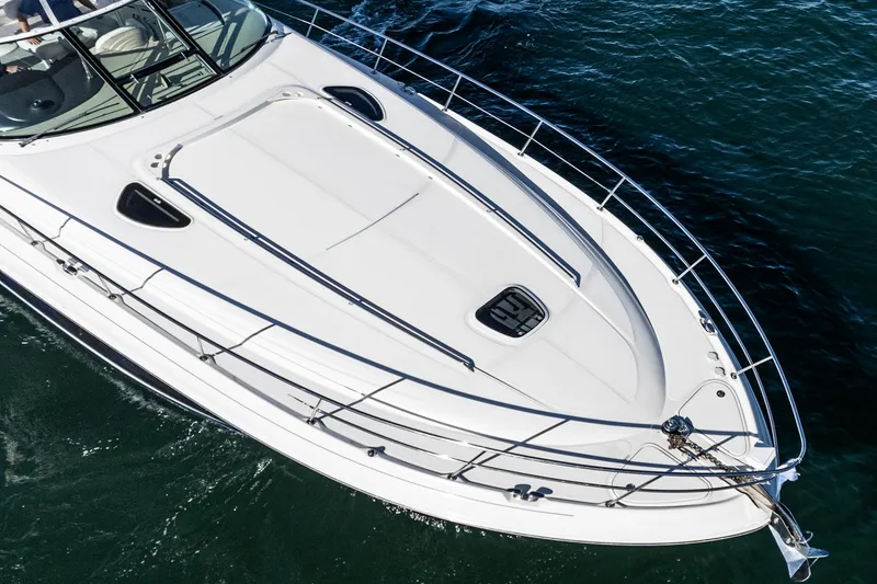 Slide: The Image of 2005 Sea Ray 500 Sundancer yacht cruising on open water, top view. - 27