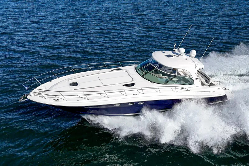Slide: The Image of 2005 Sea Ray 500 Sundancer cruising on open water, showcasing sleek design and powerful performance. - 3