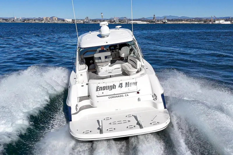 Slide: The Image of 2005 Sea Ray 500 Sundancer cruising on open water, rear view. - 31