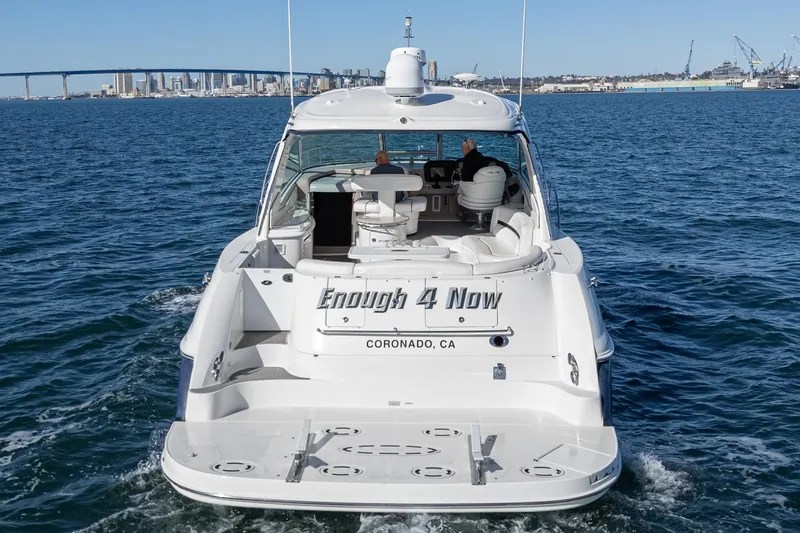 Slide: The Image of 2005 Sea Ray 500 Sundancer yacht cruising near Coronado, CA with city skyline in background. - 32