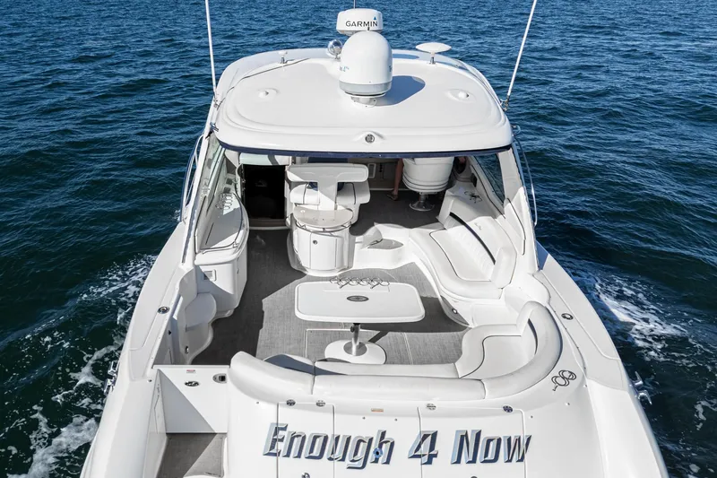 Slide: The Image of 2005 Sea Ray 500 Sundancer yacht cruising on open water, rear view. - 34
