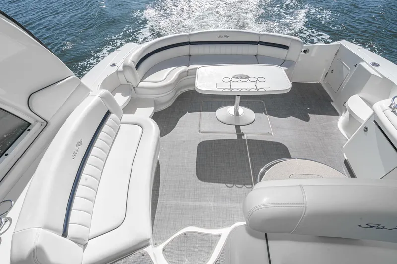 Slide: The Image of 2005 Sea Ray 500 Sundancer yacht interior with elegant seating and table on open water. - 37