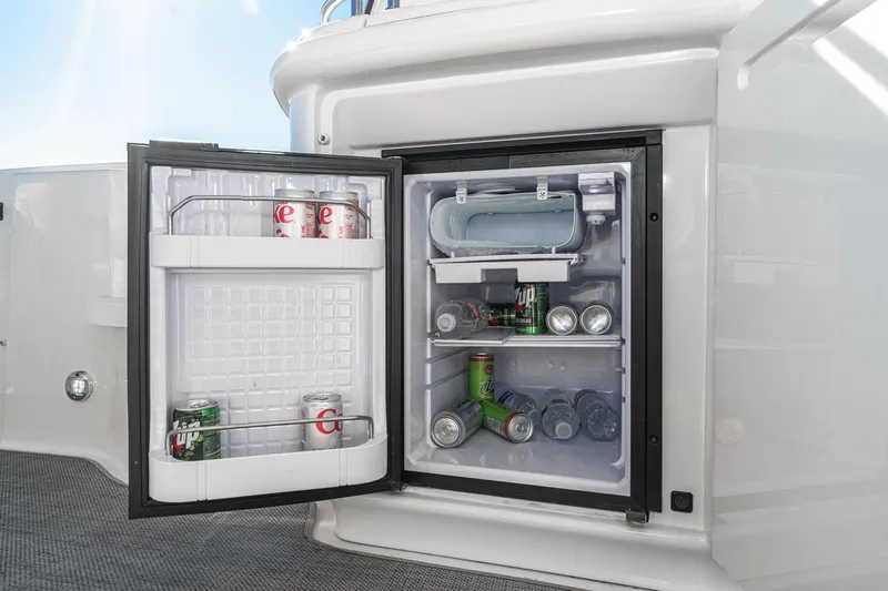 Slide: The Image of Open mini fridge on 2005 Sea Ray 500 Sundancer yacht, stocked with beverages. - 40