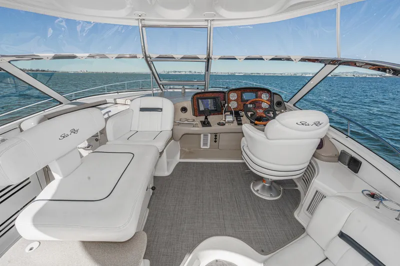 Slide: The Image of 2005 Sea Ray 500 Sundancer yacht cockpit with luxurious seating and ocean view. - 44