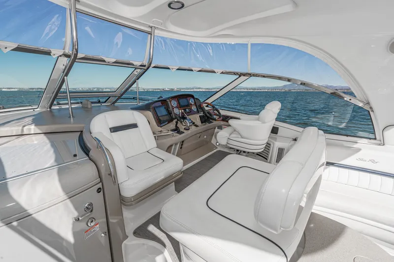 Slide: The Image of Luxurious 2005 Sea Ray 500 Sundancer yacht cockpit with plush seating and ocean view. - 45