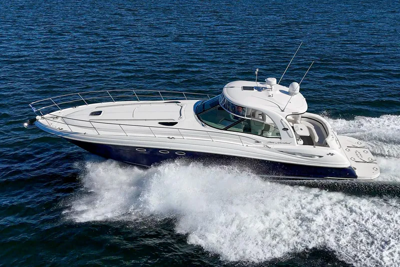 Slide: The Image of 2005 Sea Ray 500 Sundancer cruising on open water, showcasing sleek design and powerful performance. - 5