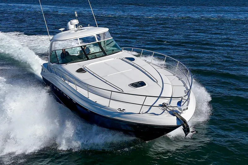 Slide: The Image of 2005 Sea Ray 500 Sundancer cruising on open water, showcasing sleek design and powerful performance. - 7
