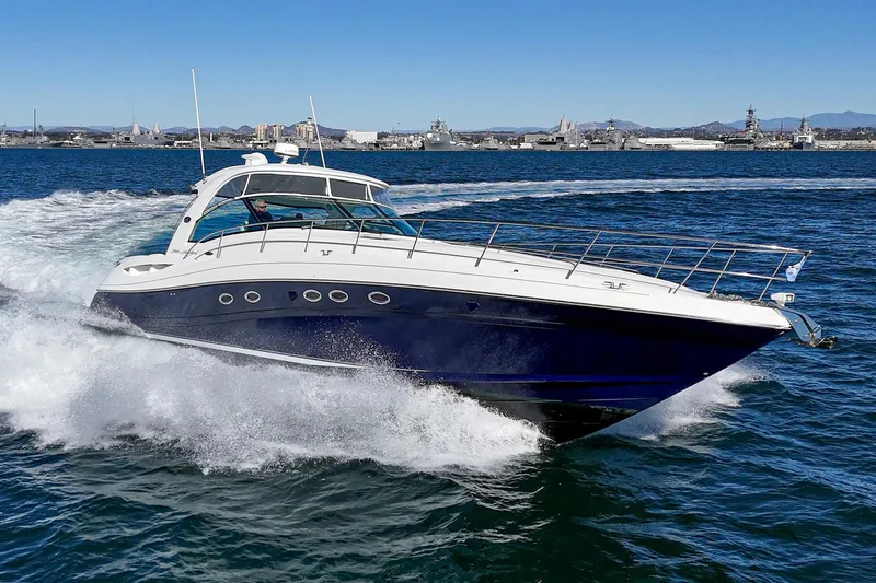 Slide: The Image of 2005 Sea Ray 500 Sundancer cruising on open water, showcasing sleek design and powerful performance. - 8