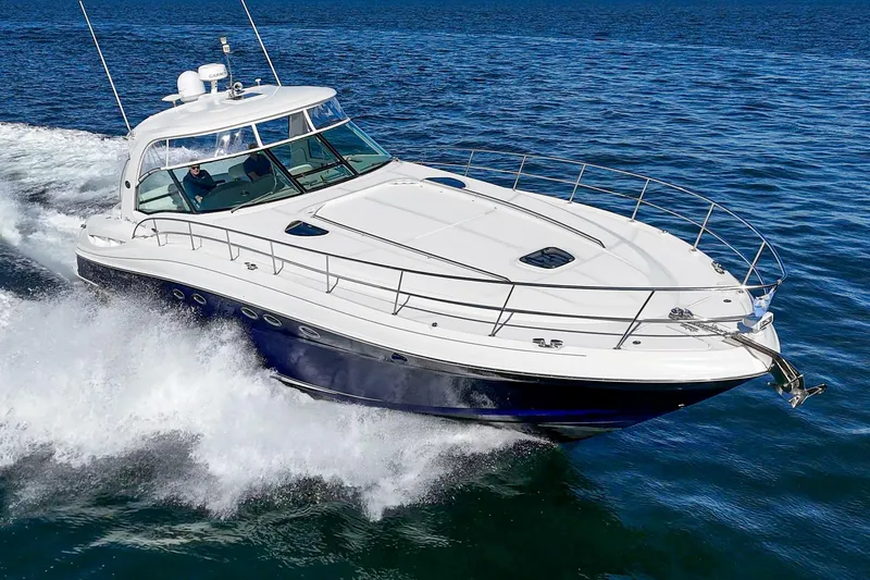 Slide: The Image of 2005 Sea Ray 500 Sundancer cruising on open water, showcasing sleek design and powerful performance. - 9