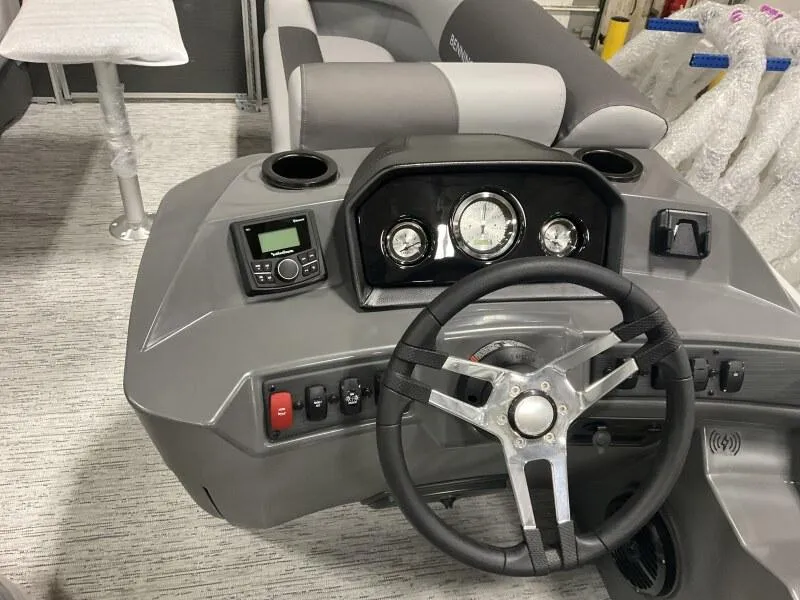 Slide: The Image of 2025 Bennington 20 S STERN RADIUS boat dashboard with steering wheel and controls. - 4