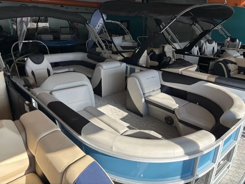 Slide: The Image of 2024 South Bay 200 Series S222CR2 pontoon boat with spacious seating and modern design. - 10