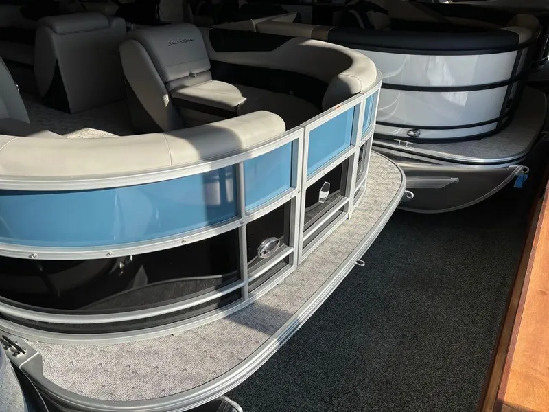Slide: The Image of 2024 South Bay 200 Series S222CR2 pontoon boat interior with seating and railing. - 11