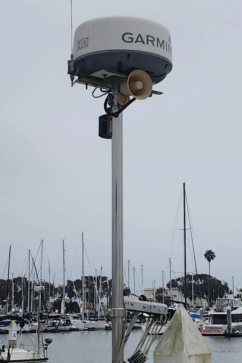 Slide: The Image of Garmin radar on Catalina 42 MkII sailboat, marina background, overcast sky. - 10