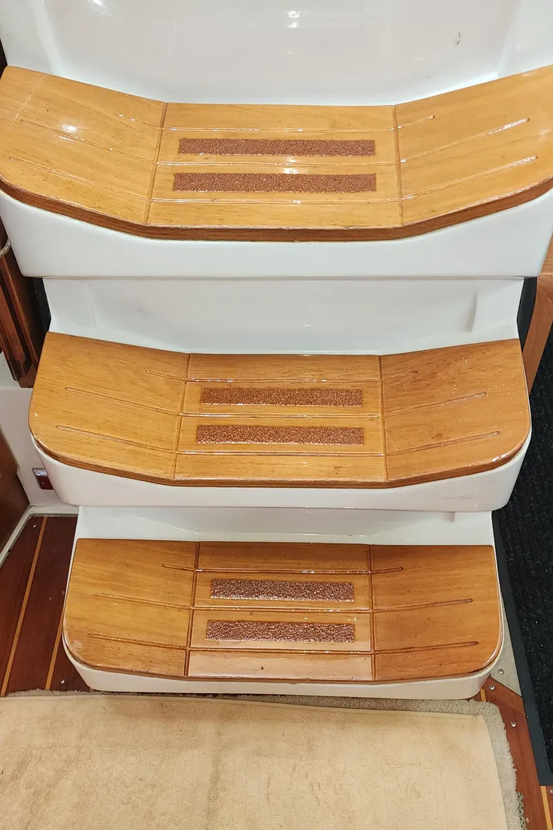 Slide: The Image of Wooden steps on a 1995 Catalina 42 MkII sailboat interior. - 16