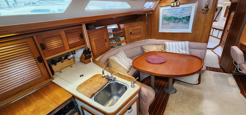 Slide: The Image of Interior of 1995 Catalina 42 MkII sailboat with kitchen and dining area. - 20