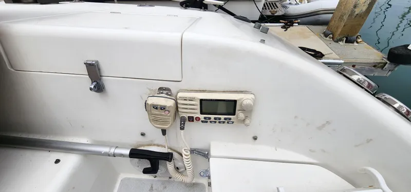 Slide: The Image of Control panel of a 1995 Catalina 42 MkII sailboat with radio and microphone. - 4