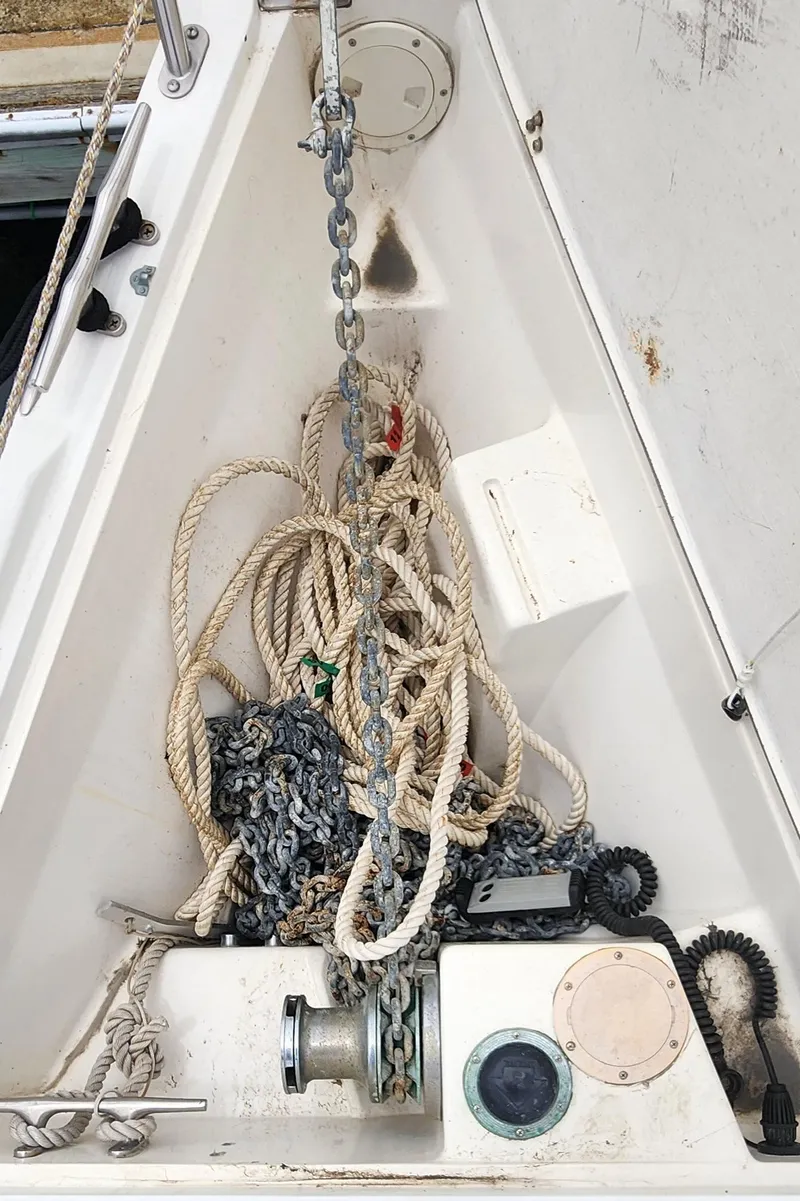 Slide: The Image of Anchor locker of a 1995 Catalina 42 MkII sailboat with ropes and chains. - 45
