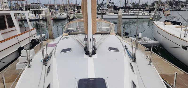Slide: The Image of Sailboat Catalina 42 MkII, 1995 model, docked in a marina with other boats. - 6