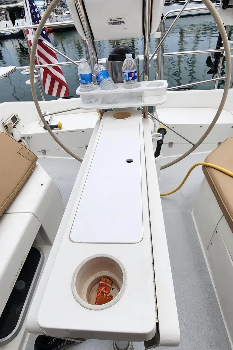 Slide: The Image of Cockpit of 1995 Catalina 42 MkII sailboat with steering wheel and drink holders. - 8