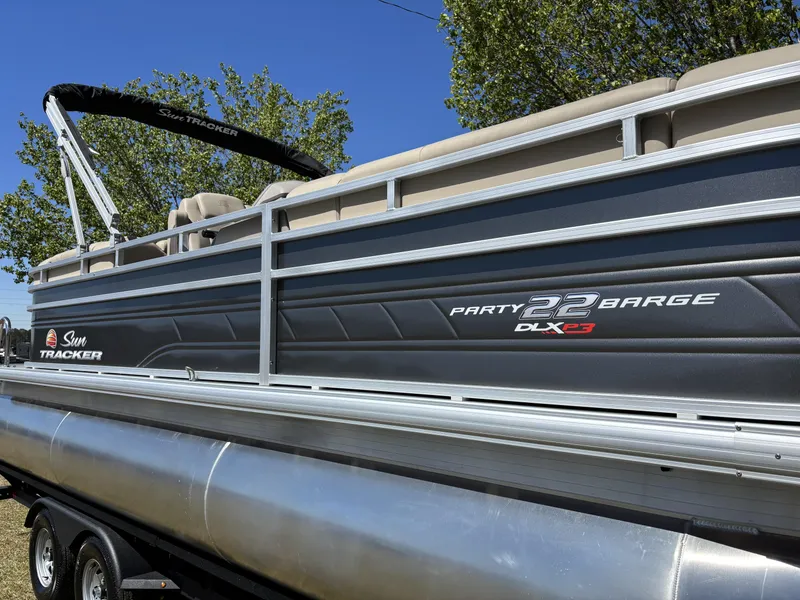 Slide: The Image of 2024 Sun Tracker Party Barge 22 XP3 pontoon boat with sleek design and comfortable seating. - 13