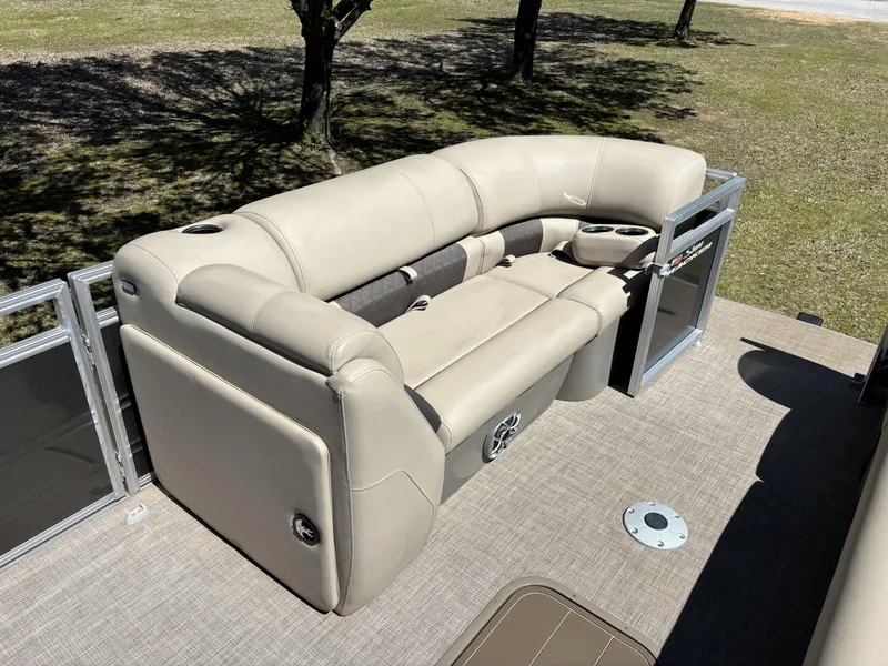 Slide: The Image of 2024 Sun Tracker Party Barge 22 XP3 with beige seating and cup holders on deck. - 16