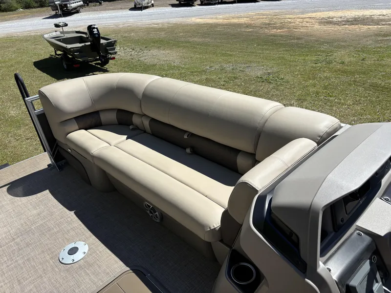 Slide: The Image of 2024 Sun Tracker Party Barge 22 XP3 with beige seating and spacious deck. - 9