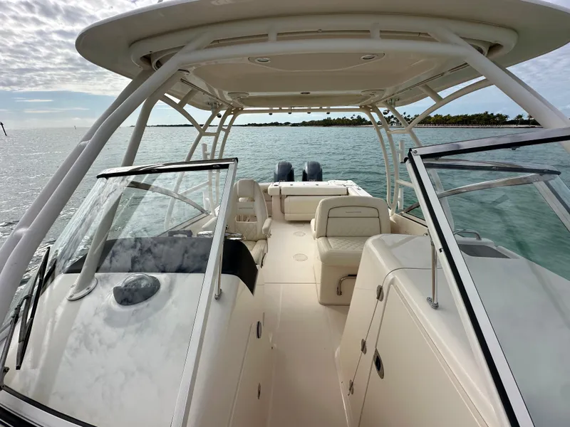 Slide: The Image of 2018 Grady-White Freedom 275 boat interior, open water view, dual console design. - 13