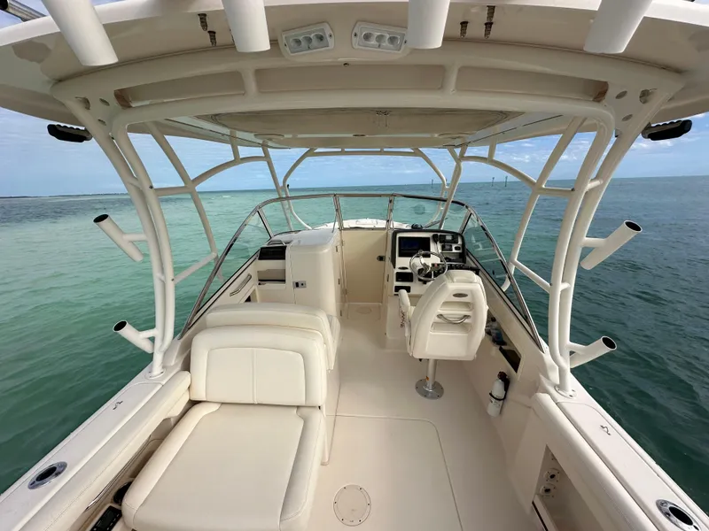 Slide: The Image of 2018 Grady-White Freedom 275 boat interior with helm, seating, and ocean view. - 29
