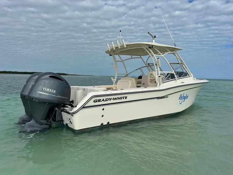 Slide: The Image of 2018 Grady-White Freedom 275 boat with Yamaha engine in clear water. - 3