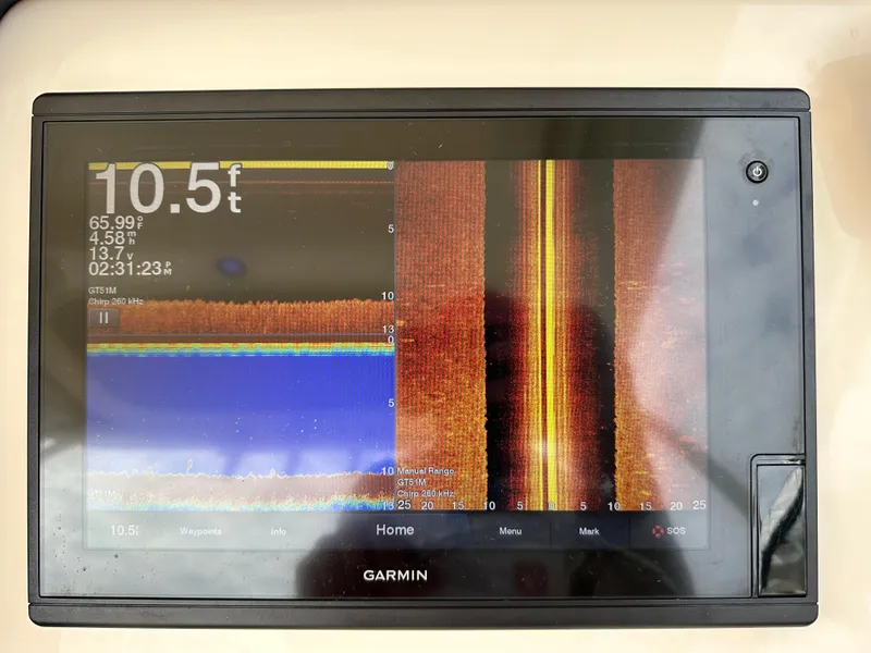 Slide: The Image of Garmin marine display showing depth and sonar data on a 2018 Grady-White Freedom 275 boat. - 31