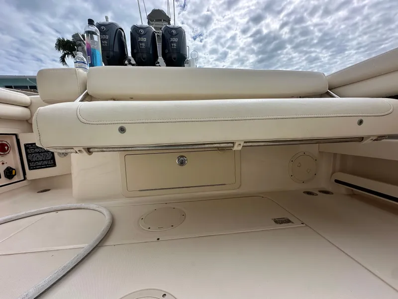 Slide: The Image of 2018 Grady-White Freedom 275 boat interior with seating and storage. - 33