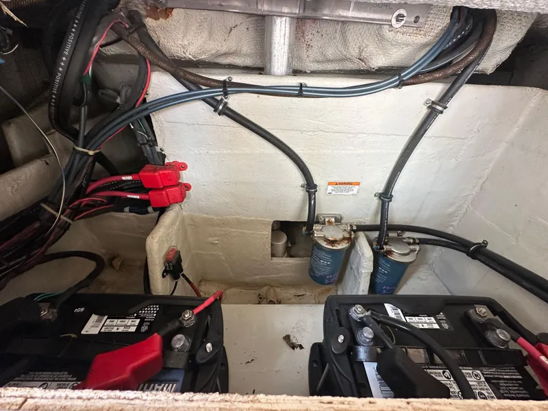 Slide: The Image of Engine compartment of 2018 Grady-White Freedom 275 with batteries and wiring. - 34