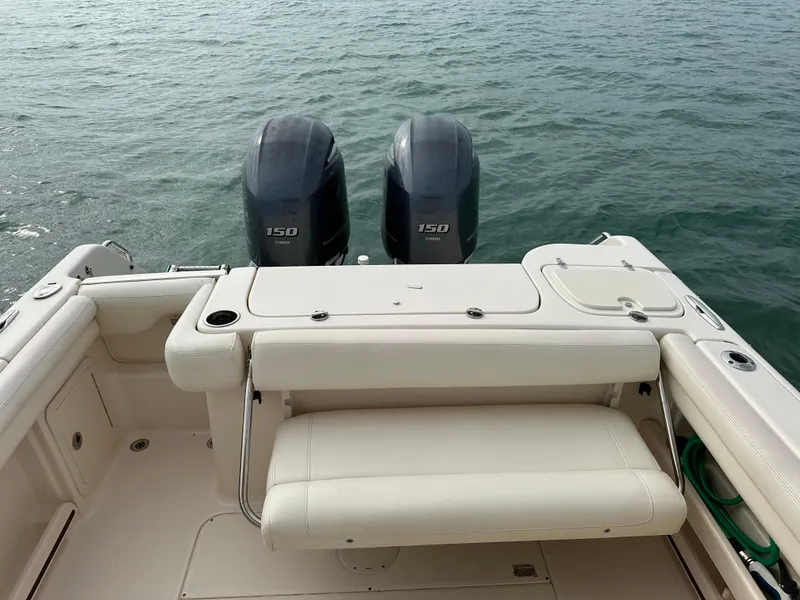 Slide: The Image of 2018 Grady-White Freedom 275 boat with twin 150 engines on calm water. - 7