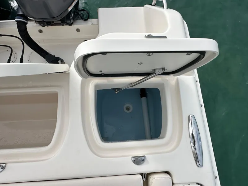 Slide: The Image of Open storage compartment on 2018 Grady-White Freedom 275 boat, showing interior details. - 9