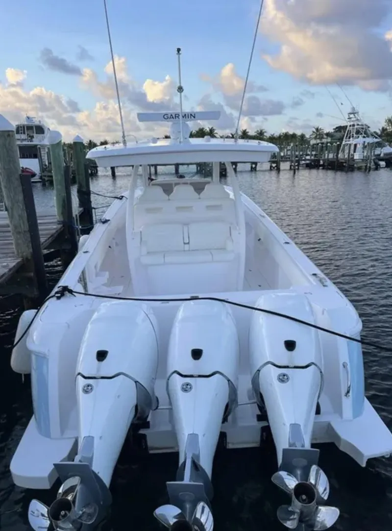 Slide: The Image of 2022 Intrepid 407 Nomad SE boat docked in harbor. - 10