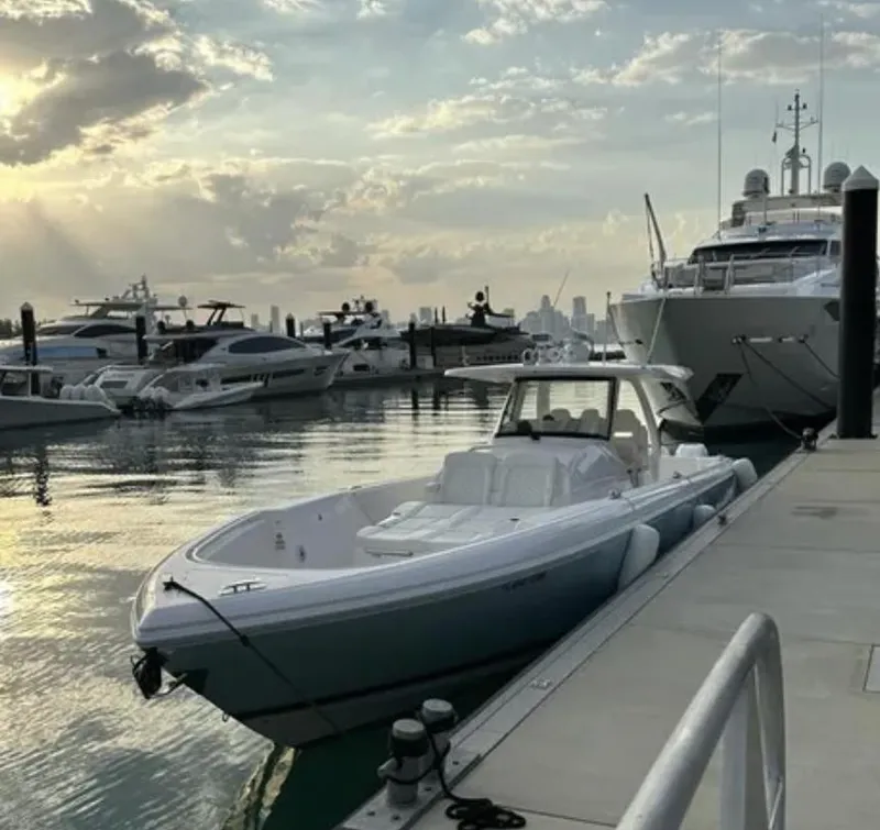 Slide: The Image of Intrepid 407 Nomad SE 2022 docked at sunset harbor. - 11