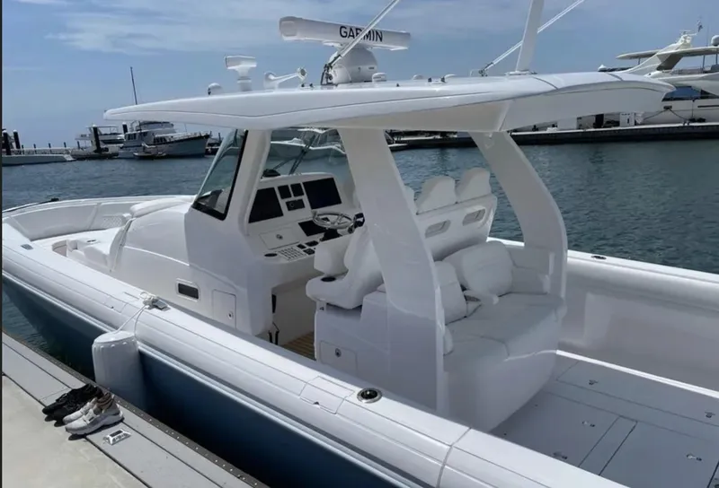 Slide: The Image of 2022 Intrepid 407 Nomad SE boat docked at marina. - 5