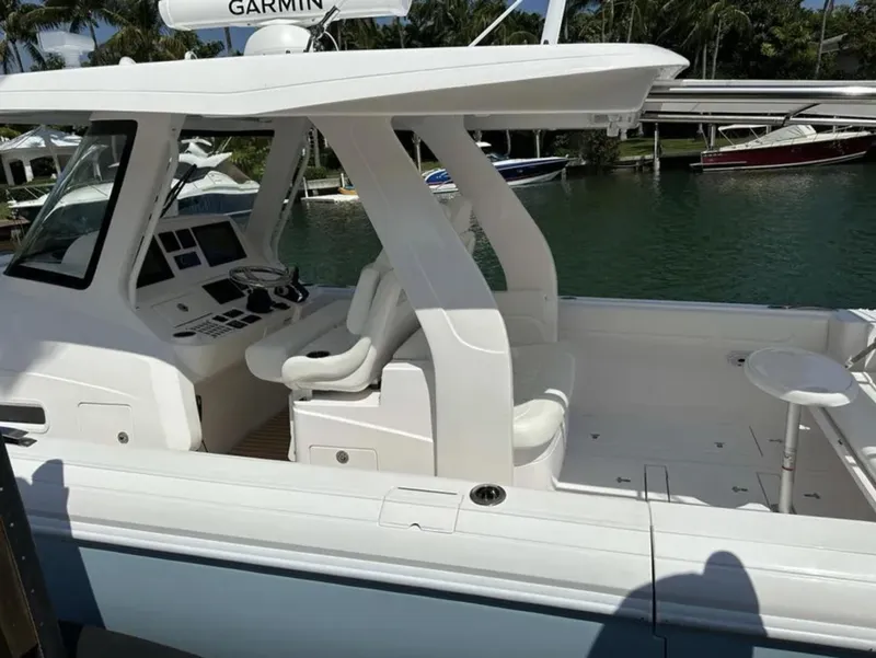 Slide: The Image of 2022 Intrepid 407 Nomad SE boat docked. - 6