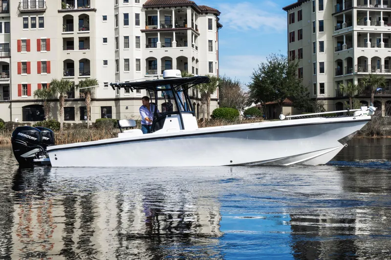 The Image of 2001 Privateer 2800 SEA PROWLER boat on water near waterfront buildings. - 0