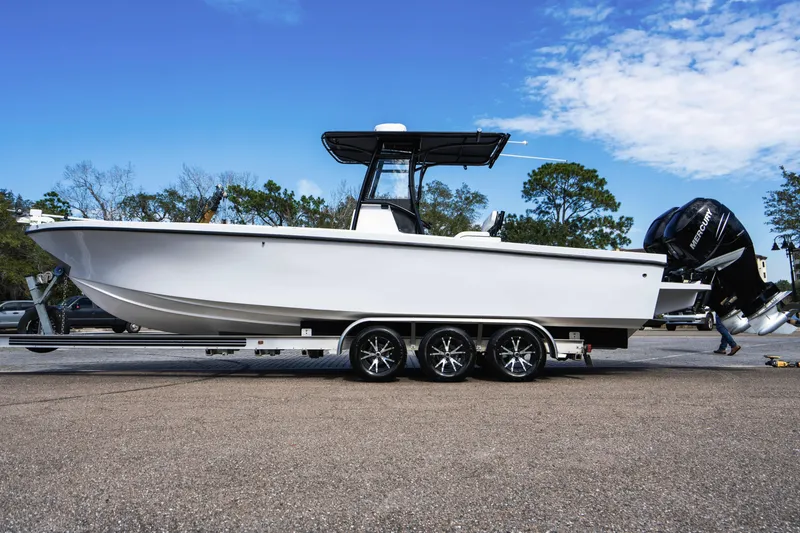 Slide: The Image of 2001 Privateer 2800 SEA PROWLER boat on trailer, side view, outdoors. - 6